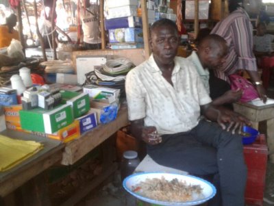 Aliou Sall in a food store in Boulbinet