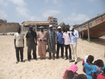 Fishers posing for a picture before exchanging with pupils about the ecosystem approach to fisheries on World Oceans Day in Yoff